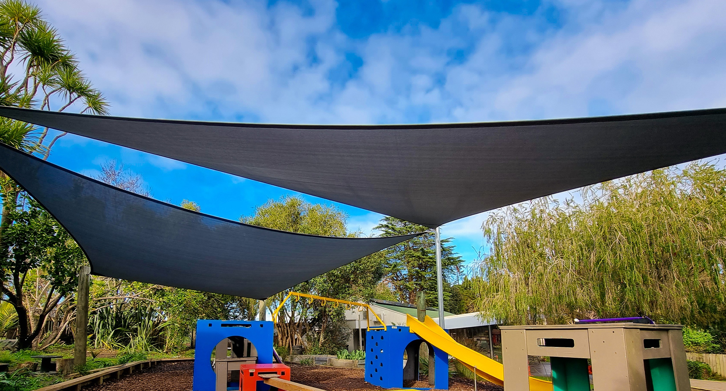Shadeland creates shaded outdoor living spaces with custom designed and installed shade sails